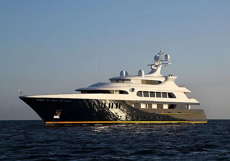 a large ship in the water aboard TANUSHA Yacht for Sale