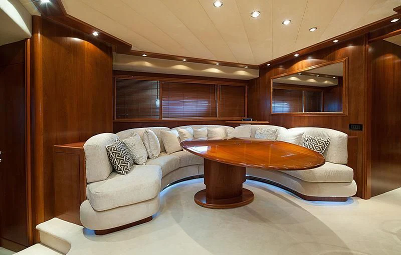 a living room with a couch and a table aboard OREA Yacht for Sale