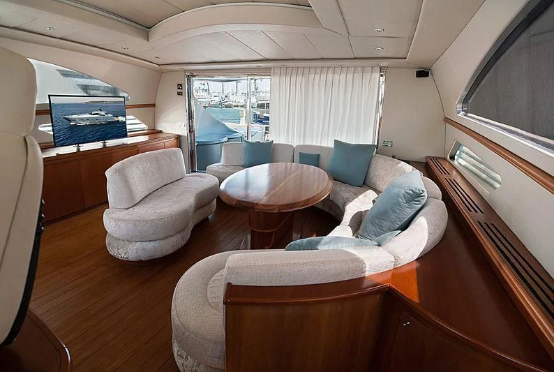 a room with a couch and a table aboard OREA Yacht for Sale