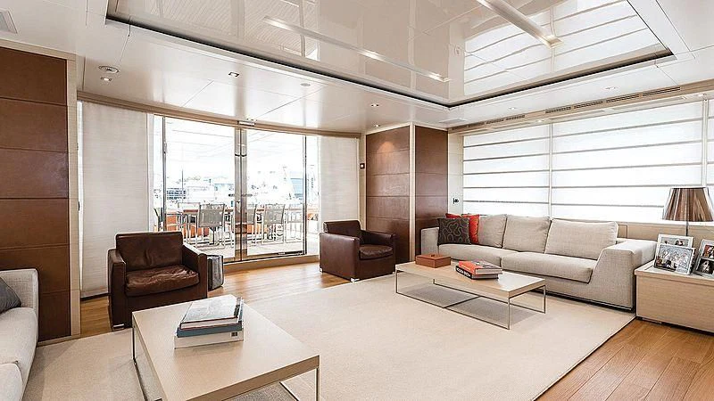 a living room with a large window aboard ABVIOS Yacht for Sale