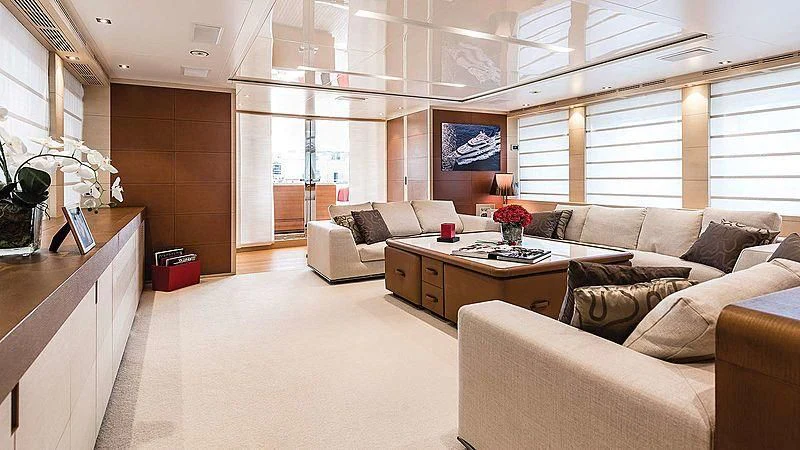 a living room with a couch and a coffee table aboard ABVIOS Yacht for Sale