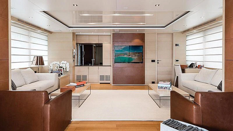a living room with a large screen aboard ABVIOS Yacht for Sale