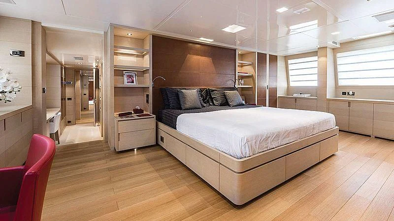 a large bedroom with a large bed aboard ABVIOS Yacht for Sale