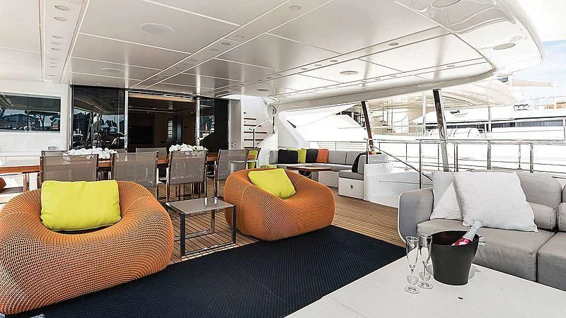 a room with couches and chairs aboard ABVIOS Yacht for Sale