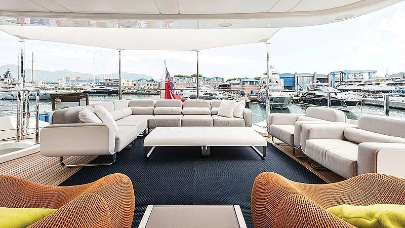a room with couches and chairs aboard ABVIOS Yacht for Sale