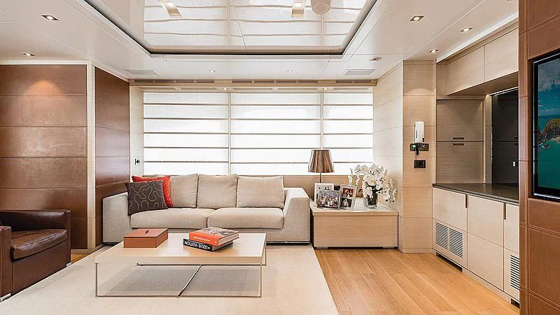 a living room with a couch and a coffee table aboard ABVIOS Yacht for Sale