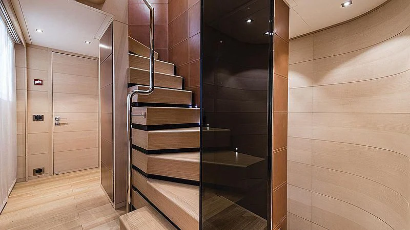 a room with a set of stairs aboard ABVIOS Yacht for Sale