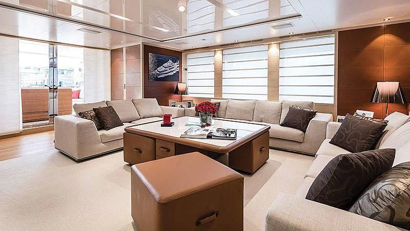 a living room with a couch and a coffee table aboard ABVIOS Yacht for Sale