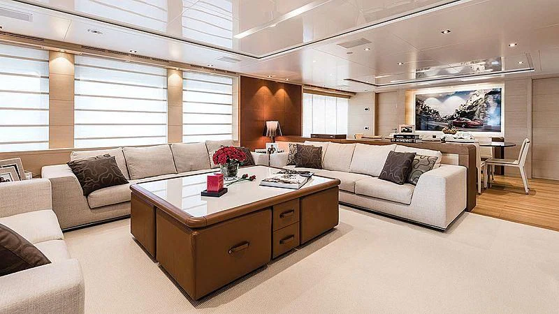 a living room with a couch and a coffee table aboard ABVIOS Yacht for Sale