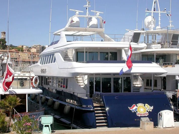 a large white boat with flags aboard YOU & ME Yacht for Sale
