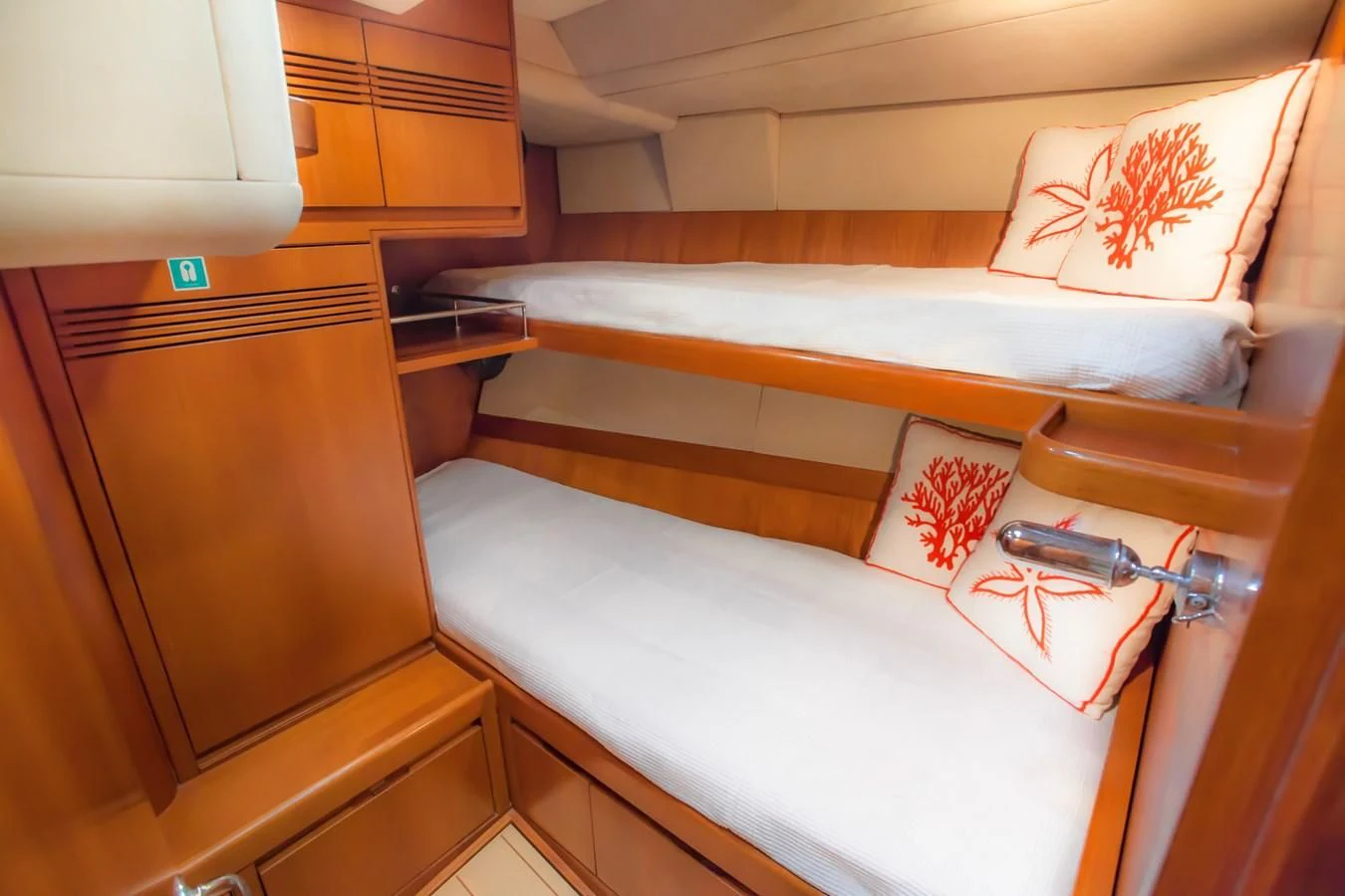 a room with a bed and a lamp aboard KIWI Yacht for Sale