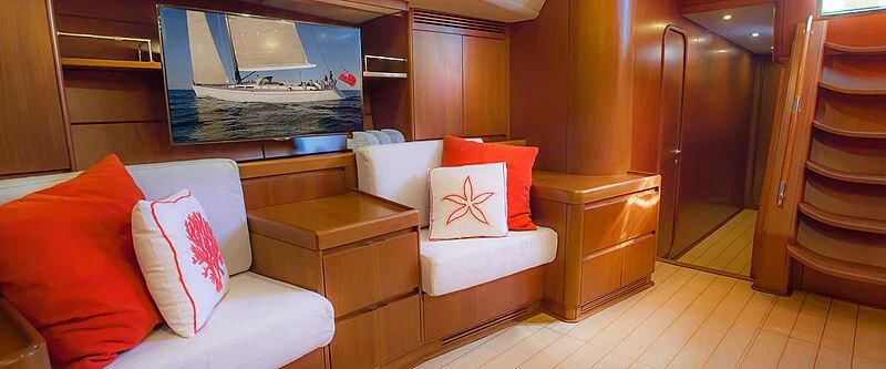 a room with a bed and a chair aboard KIWI Yacht for Sale
