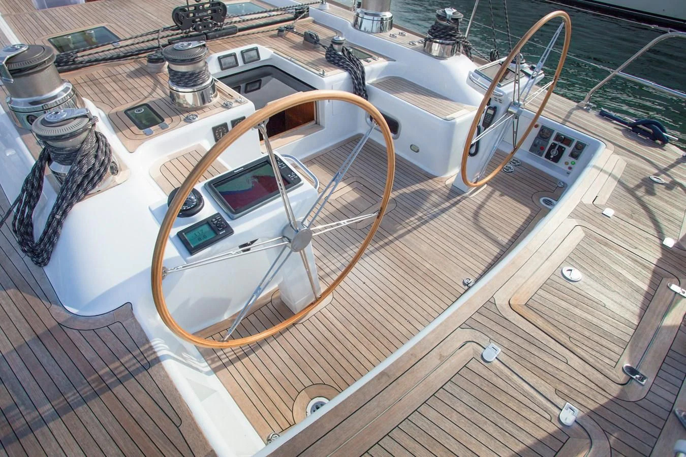 a car on a wooden deck aboard KIWI Yacht for Sale