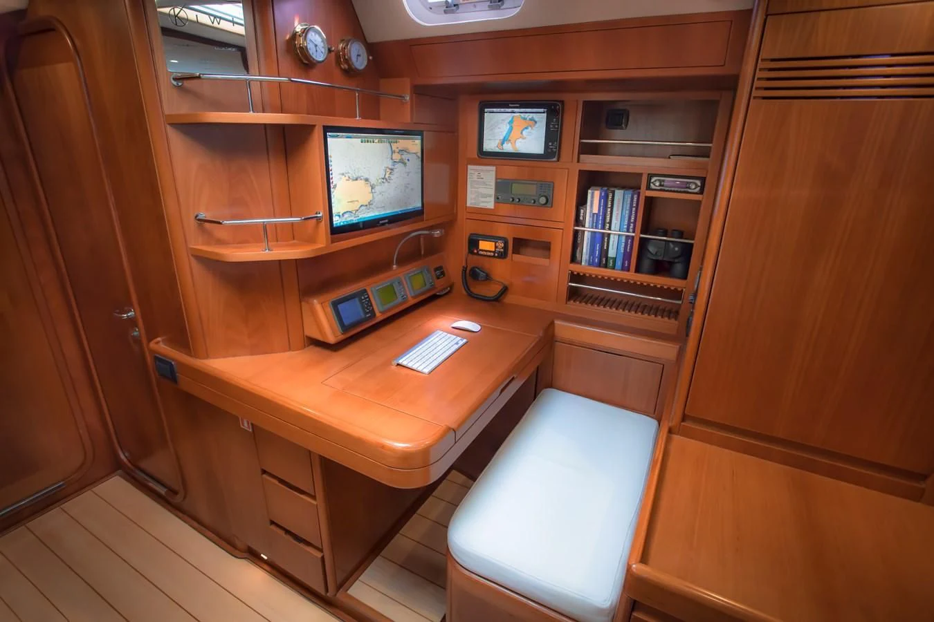 a room with a desk and a computer aboard KIWI Yacht for Sale