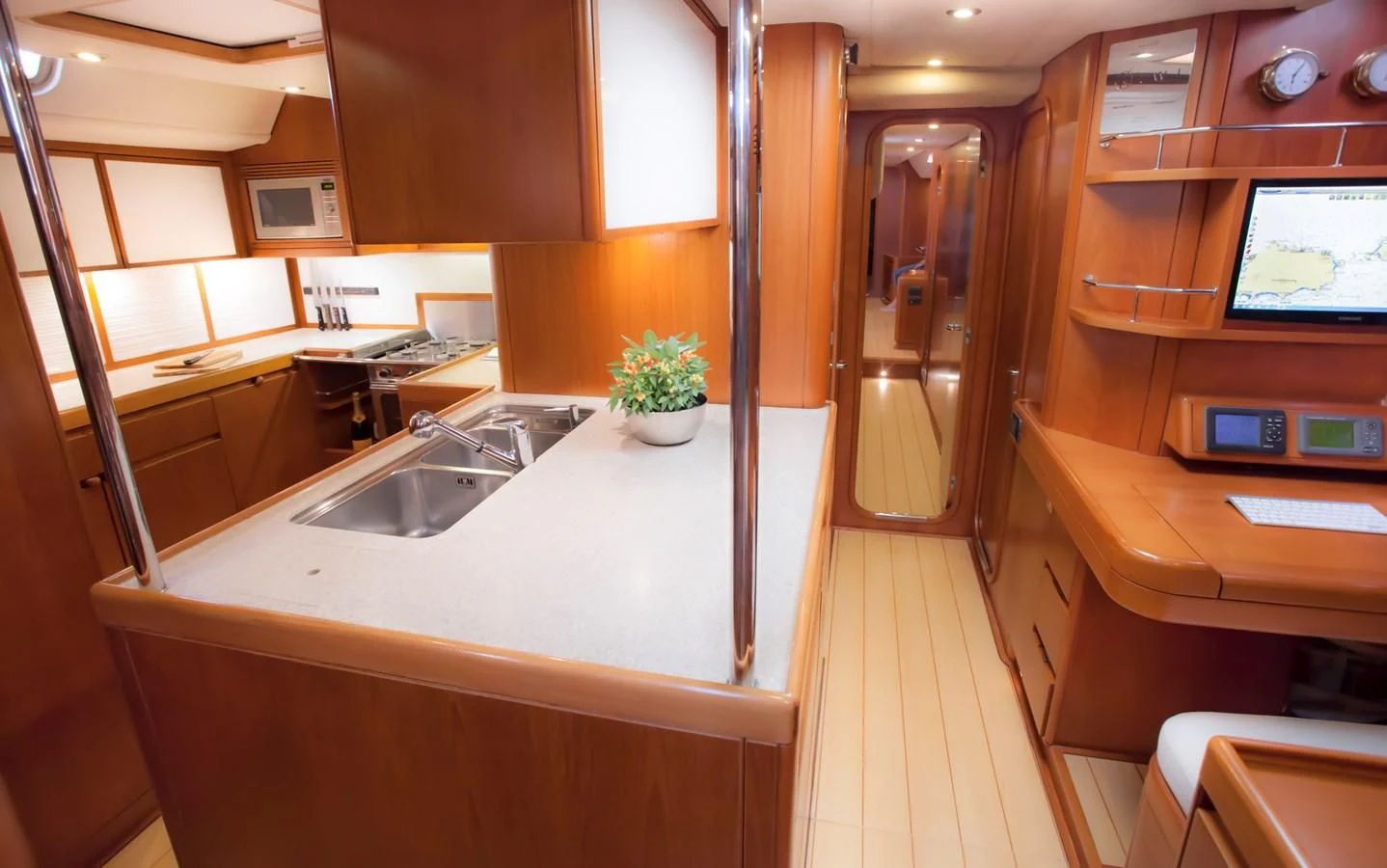 a kitchen with a sink and cabinets aboard KIWI Yacht for Sale