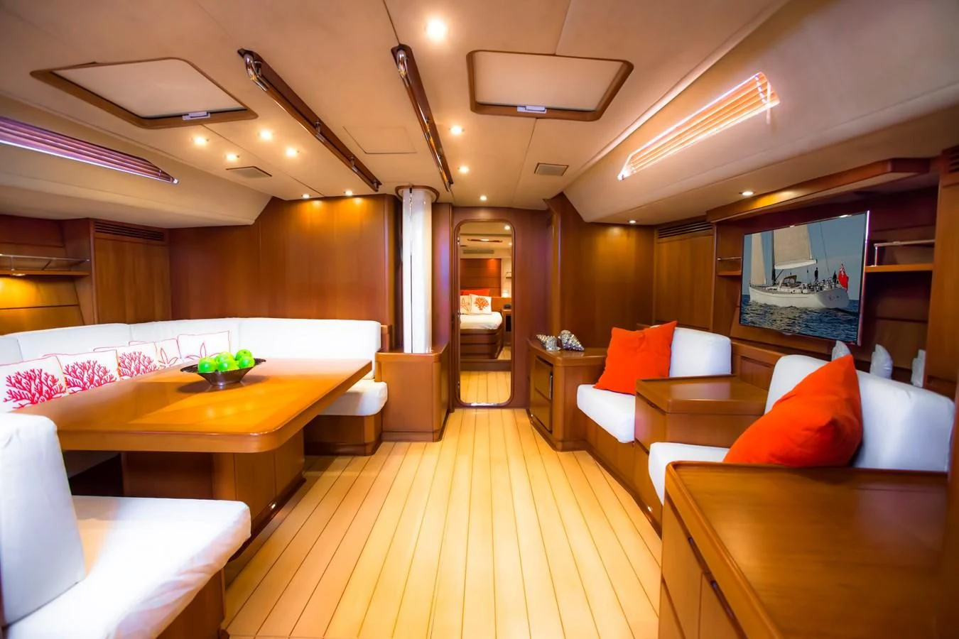 a room with a table and couches aboard KIWI Yacht for Sale
