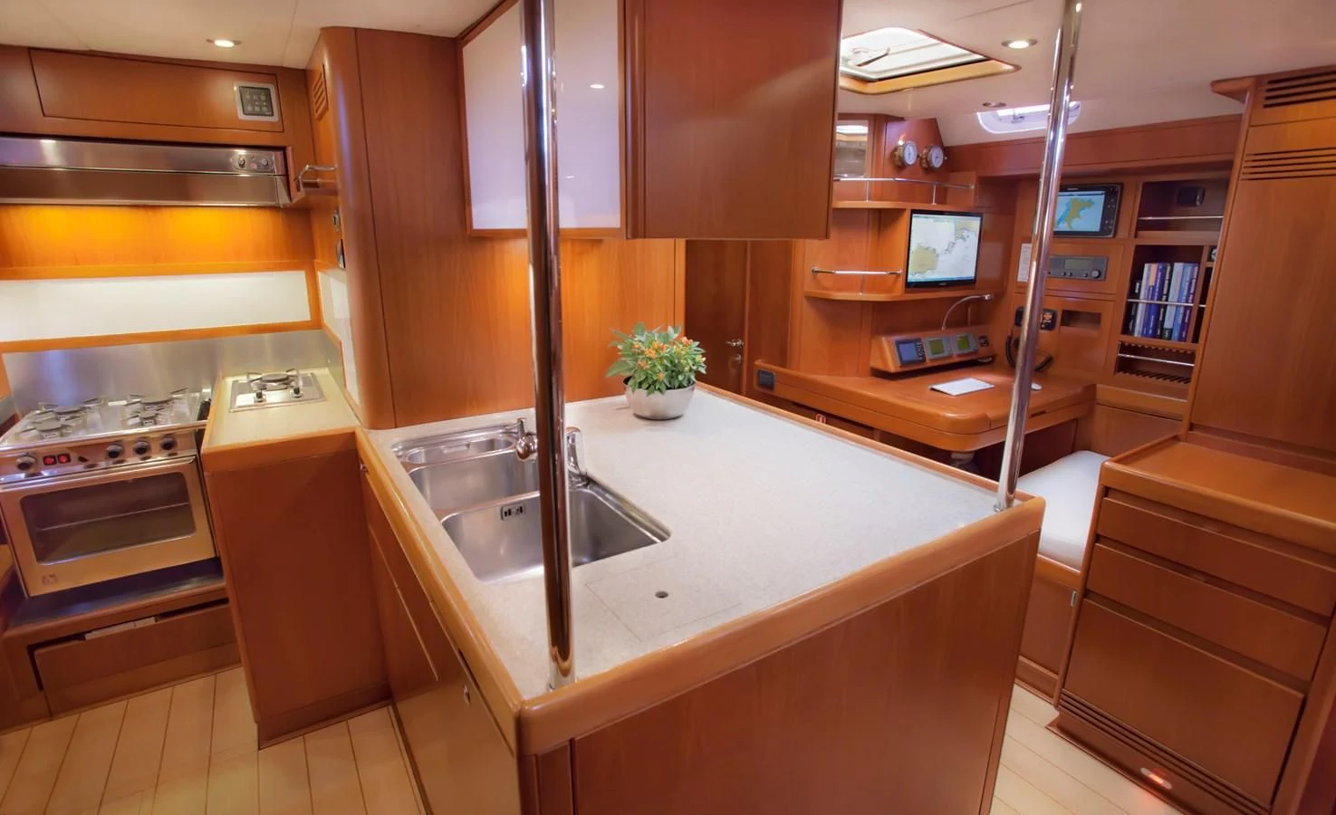 a kitchen with a sink and cabinets aboard KIWI Yacht for Sale