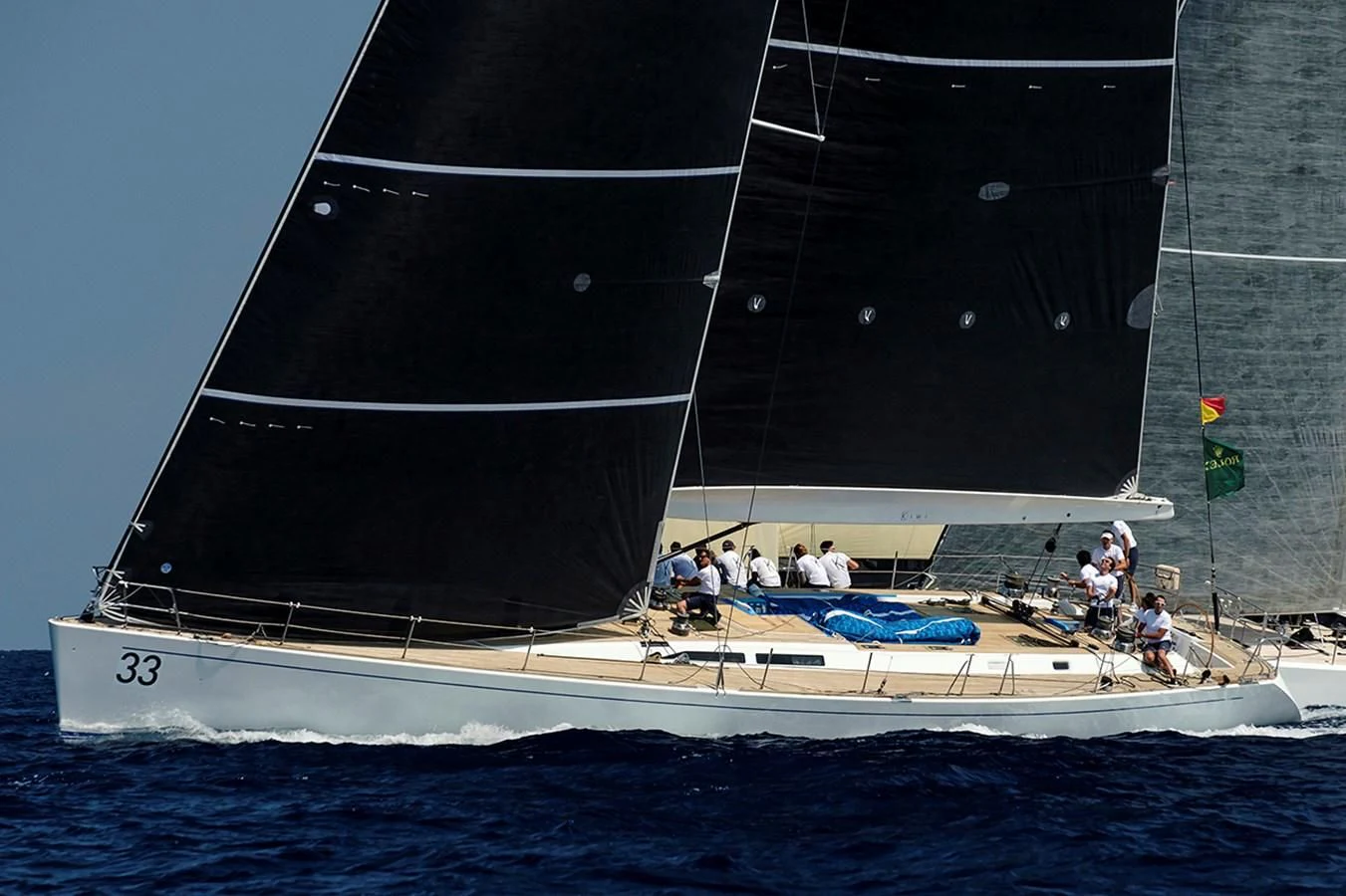 a large sailboat with people on it aboard KIWI Yacht for Sale