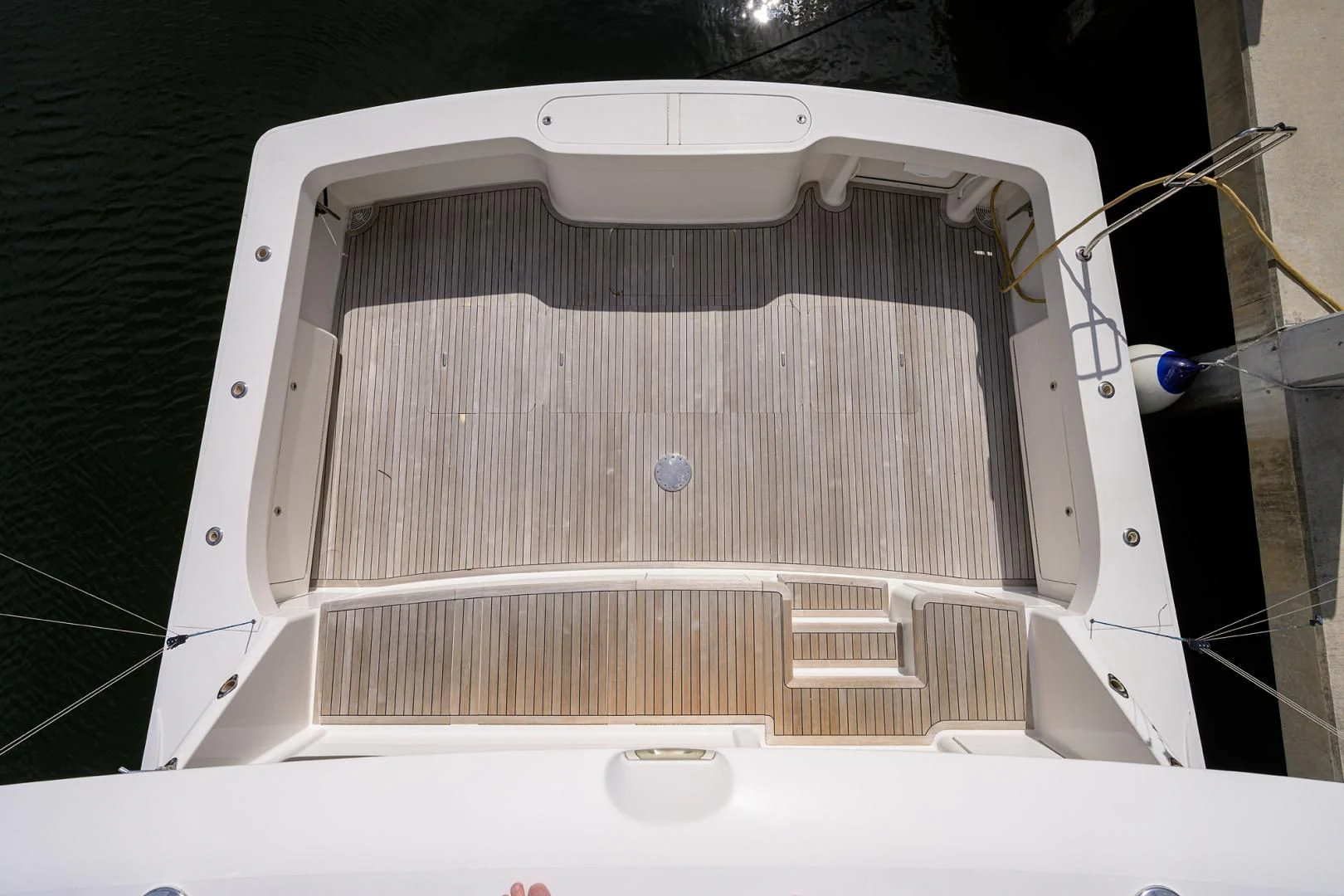 a white tub with a hose attached to it aboard KNOT RACING Yacht for Sale