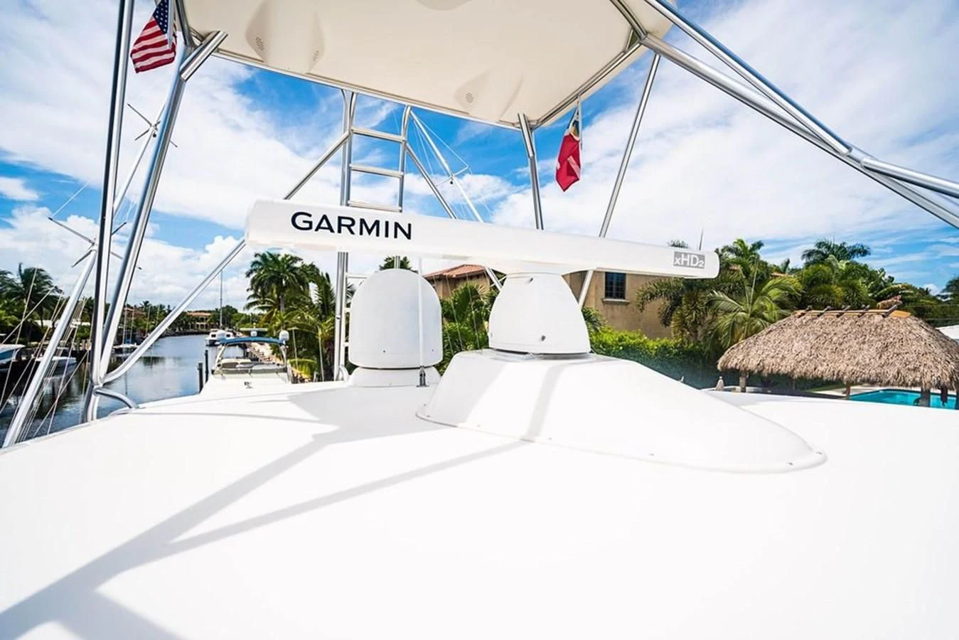 a white tent with flags aboard KNOT RACING Yacht for Sale