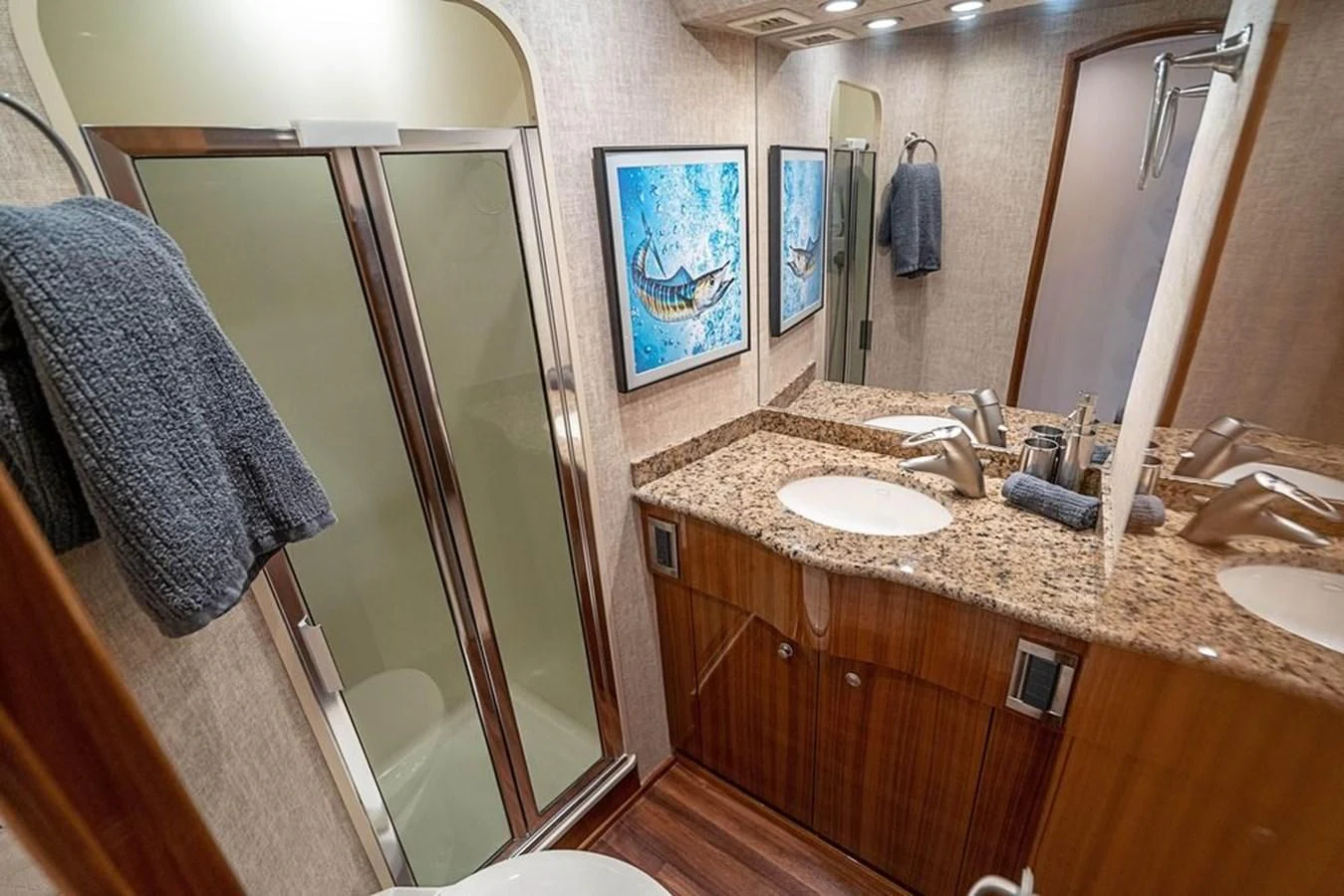 a bathroom with a countertop sink and a mirror aboard KNOT RACING Yacht for Sale
