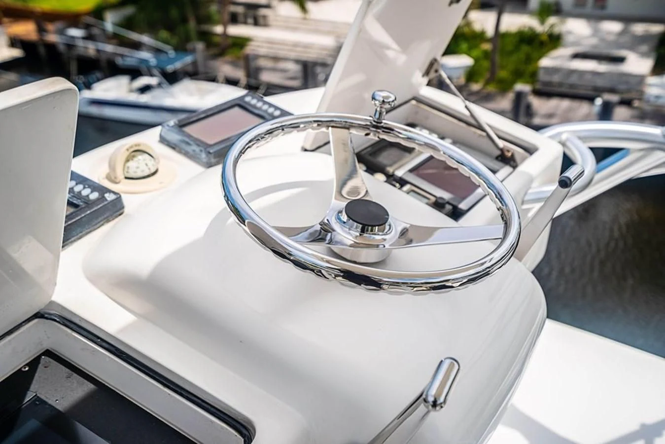 the steering wheel of a car aboard KNOT RACING Yacht for Sale