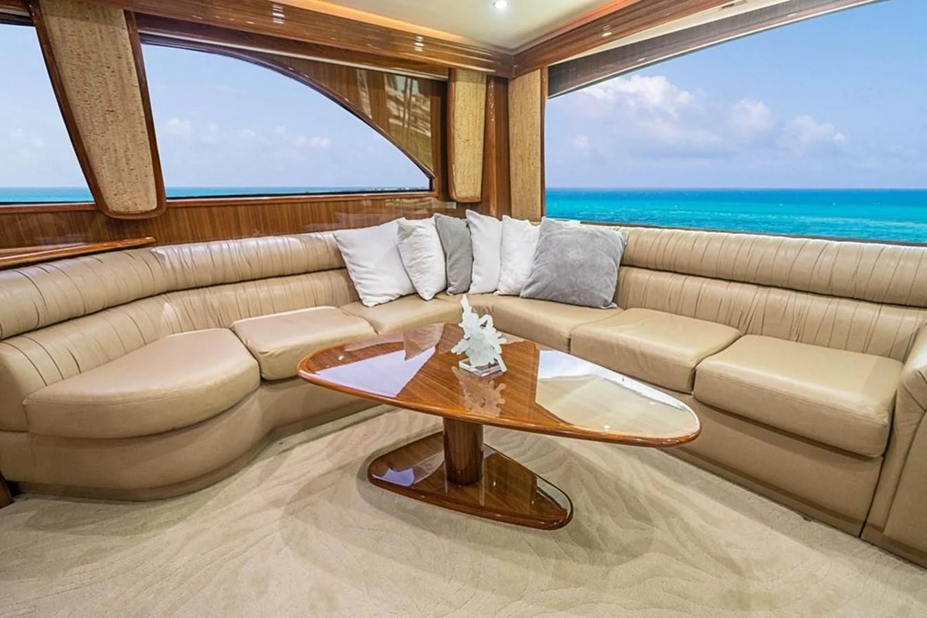a living room with a couch and a table aboard KNOT RACING Yacht for Sale