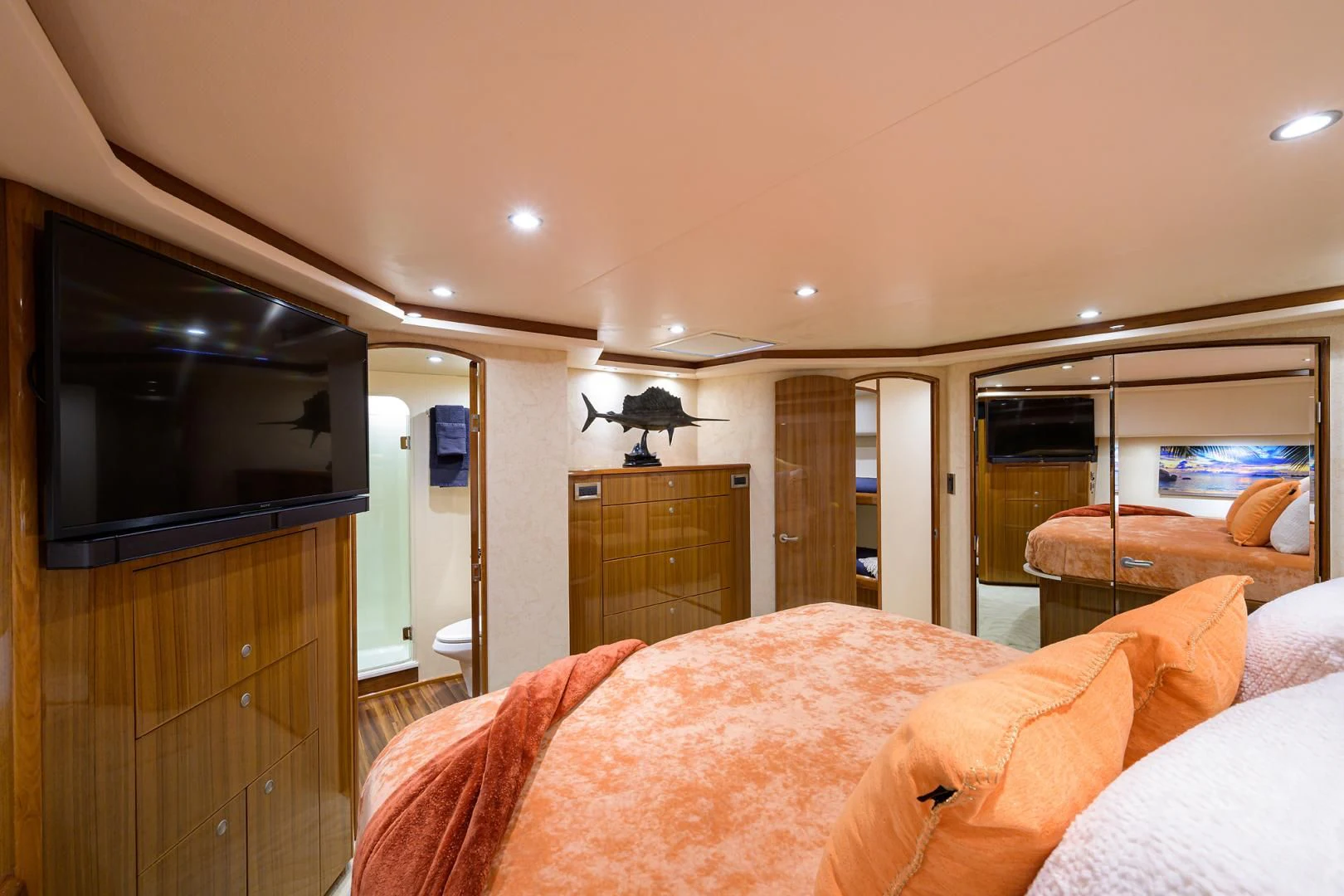 a bedroom with a tv on the wall aboard KNOT RACING Yacht for Sale