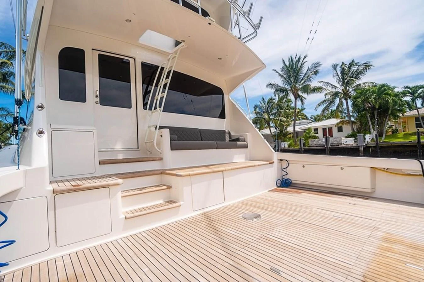 a white house with a deck aboard KNOT RACING Yacht for Sale