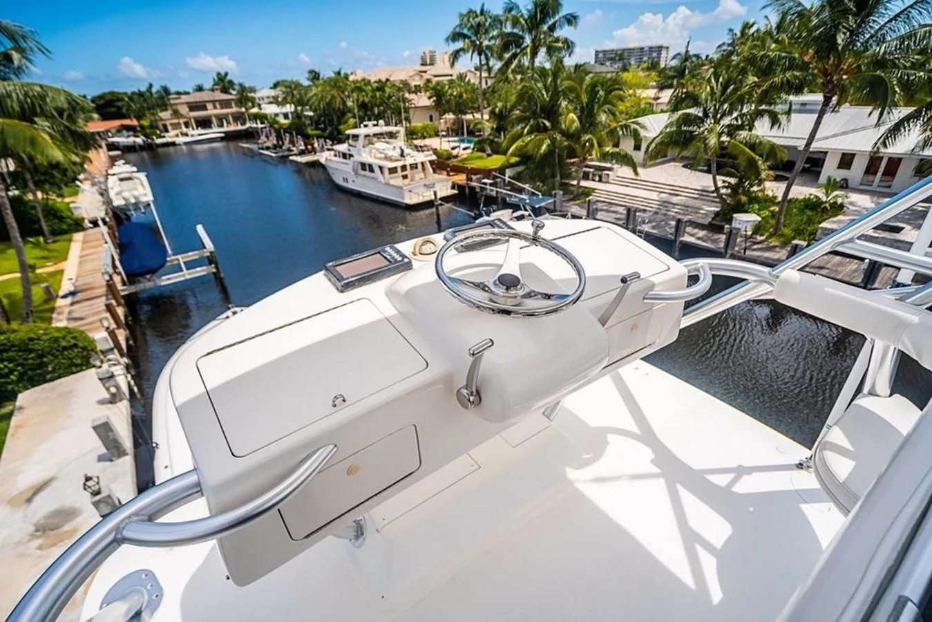 a white boat on a dock aboard KNOT RACING Yacht for Sale