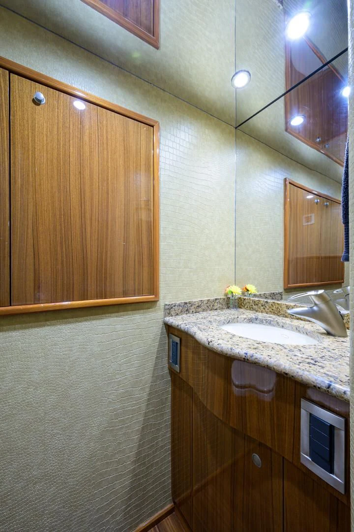 a bathroom with a sink and cabinets aboard KNOT RACING Yacht for Sale