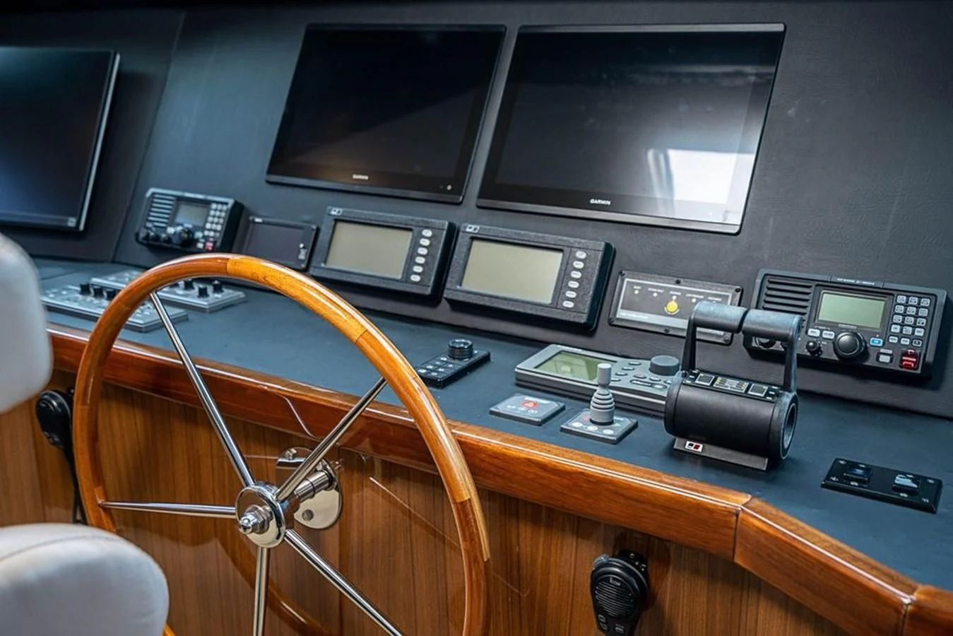 a table with electronics and a monitor aboard KNOT RACING Yacht for Sale