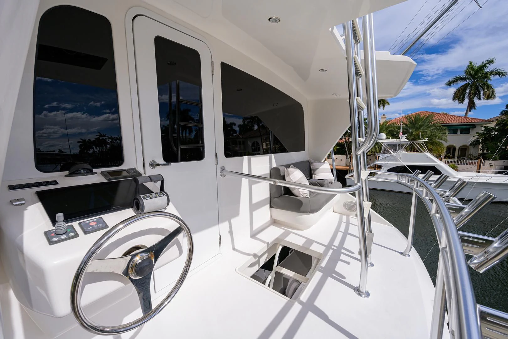 a white boat with a door open aboard KNOT RACING Yacht for Sale