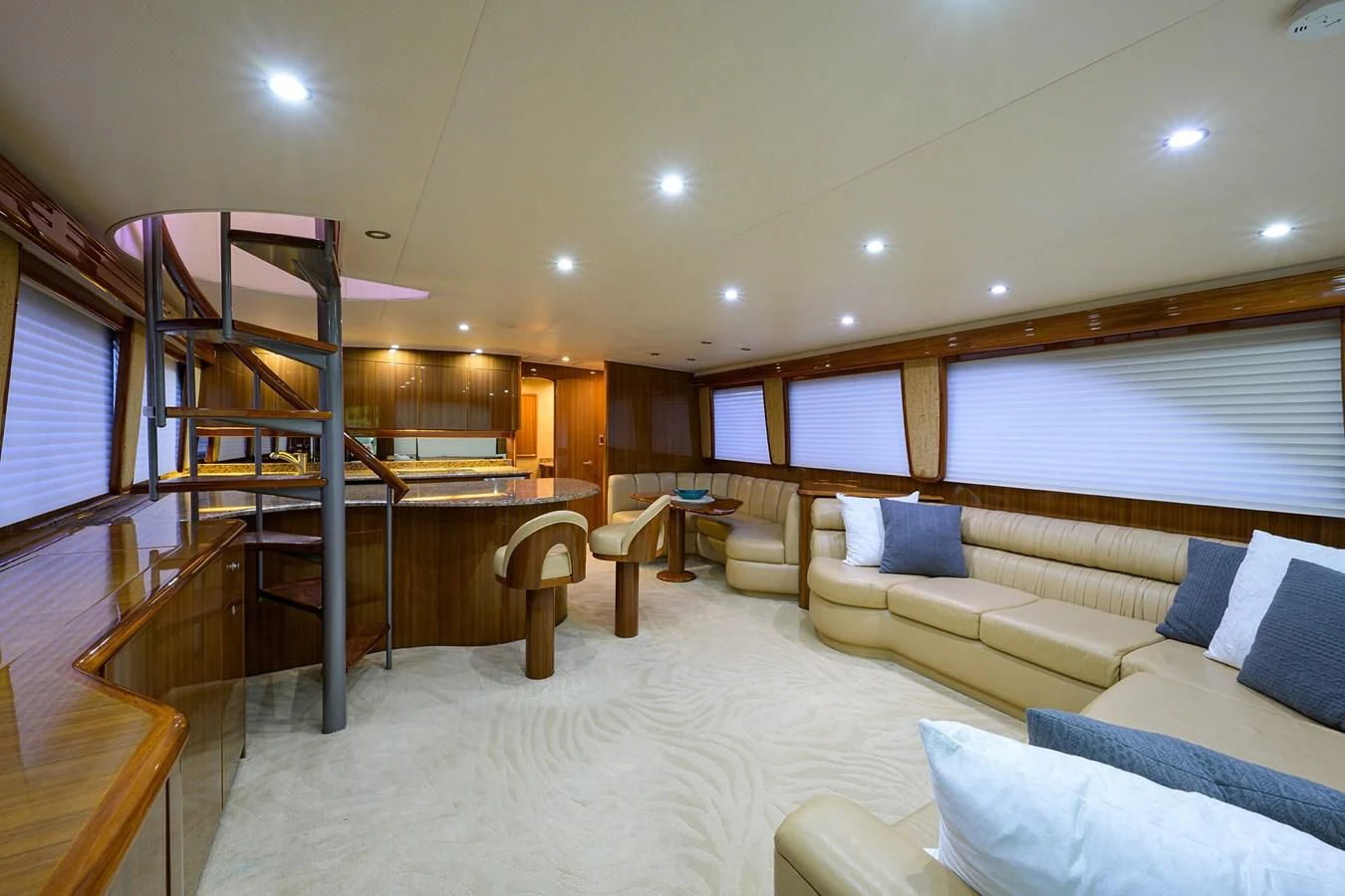 a living room with a large open staircase aboard KNOT RACING Yacht for Sale