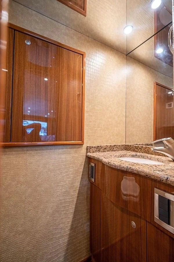 a bathroom with a sink and a mirror aboard KNOT RACING Yacht for Sale