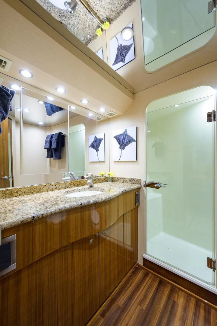 a bathroom with a large mirror aboard KNOT RACING Yacht for Sale