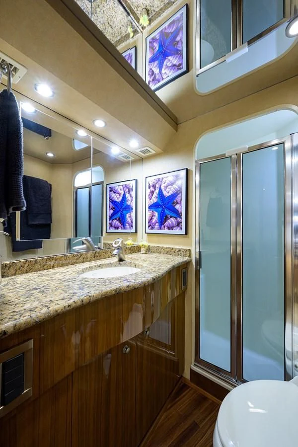 a bathroom with a large mirror aboard KNOT RACING Yacht for Sale