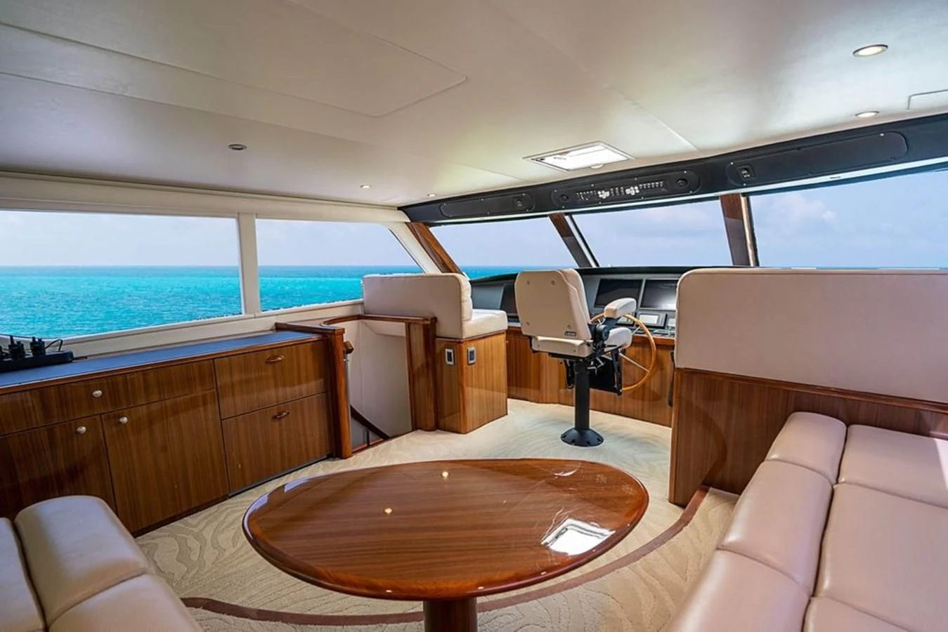 a room with a table and chairs aboard KNOT RACING Yacht for Sale