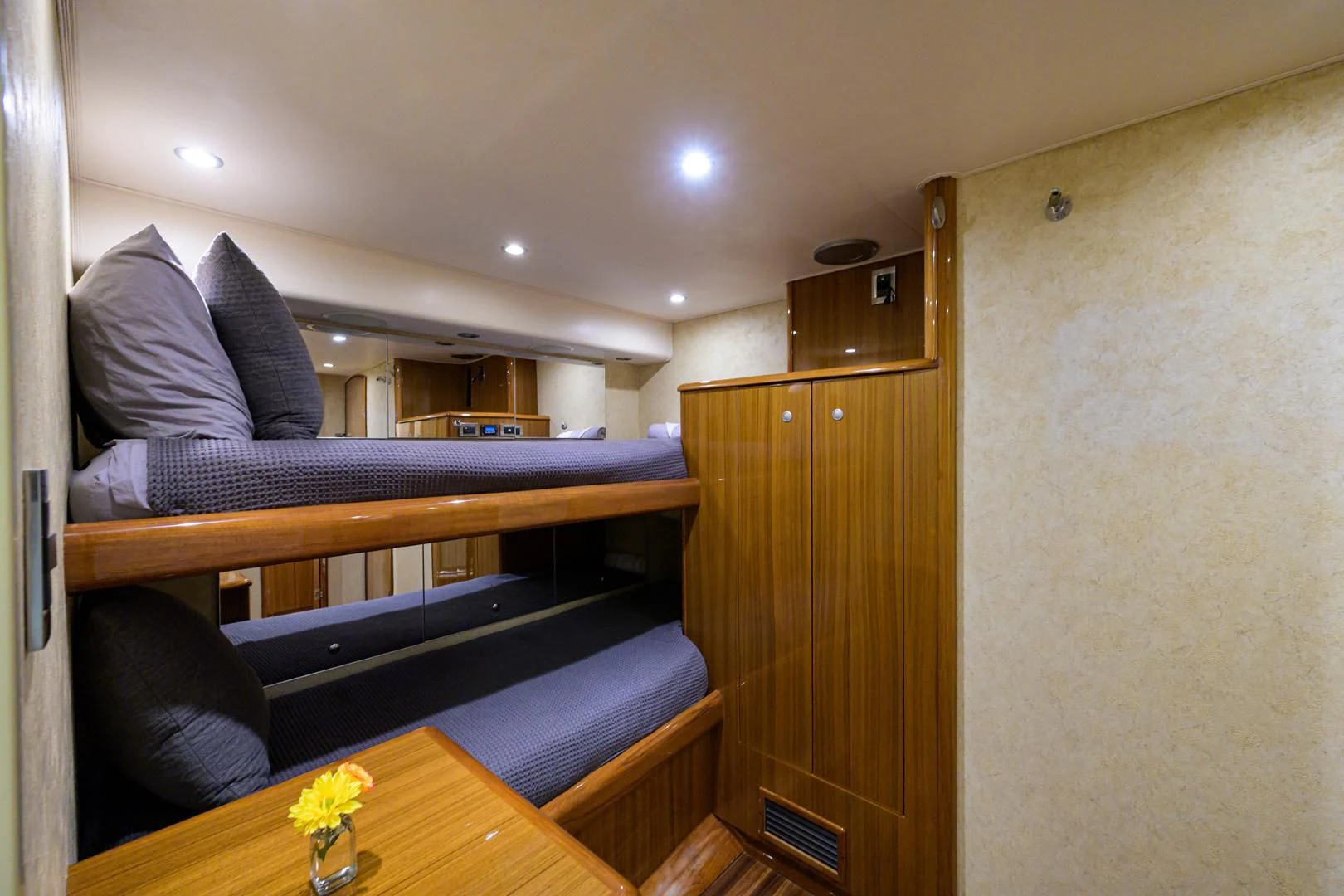 a room with a bed and a table aboard KNOT RACING Yacht for Sale