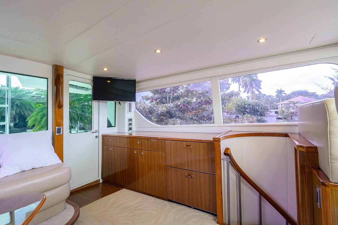 a room with a wood cabinet and a white couch and a wood cabinet aboard KNOT RACING Yacht for Sale