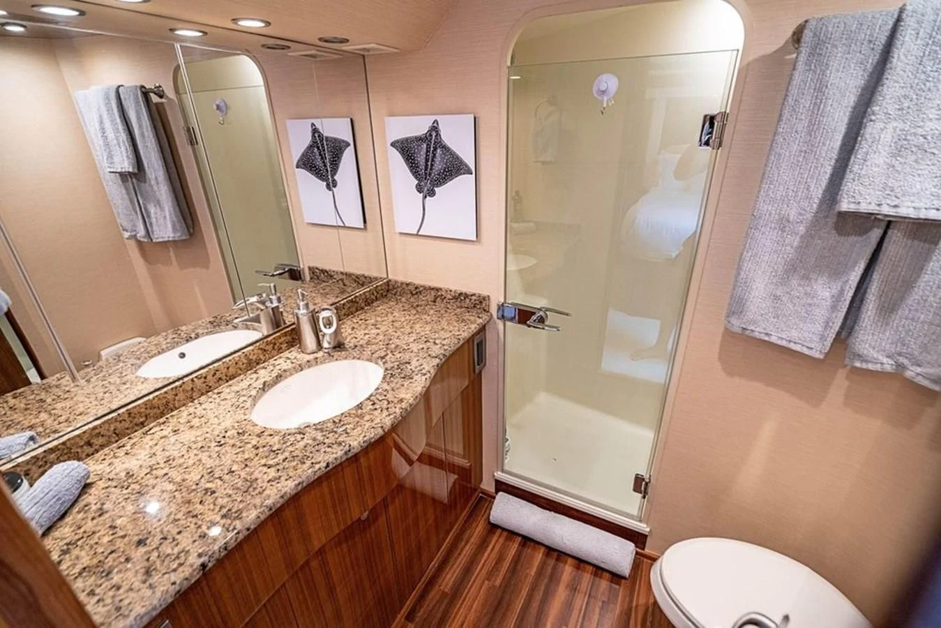 a bathroom with a countertop sink and a shower aboard KNOT RACING Yacht for Sale
