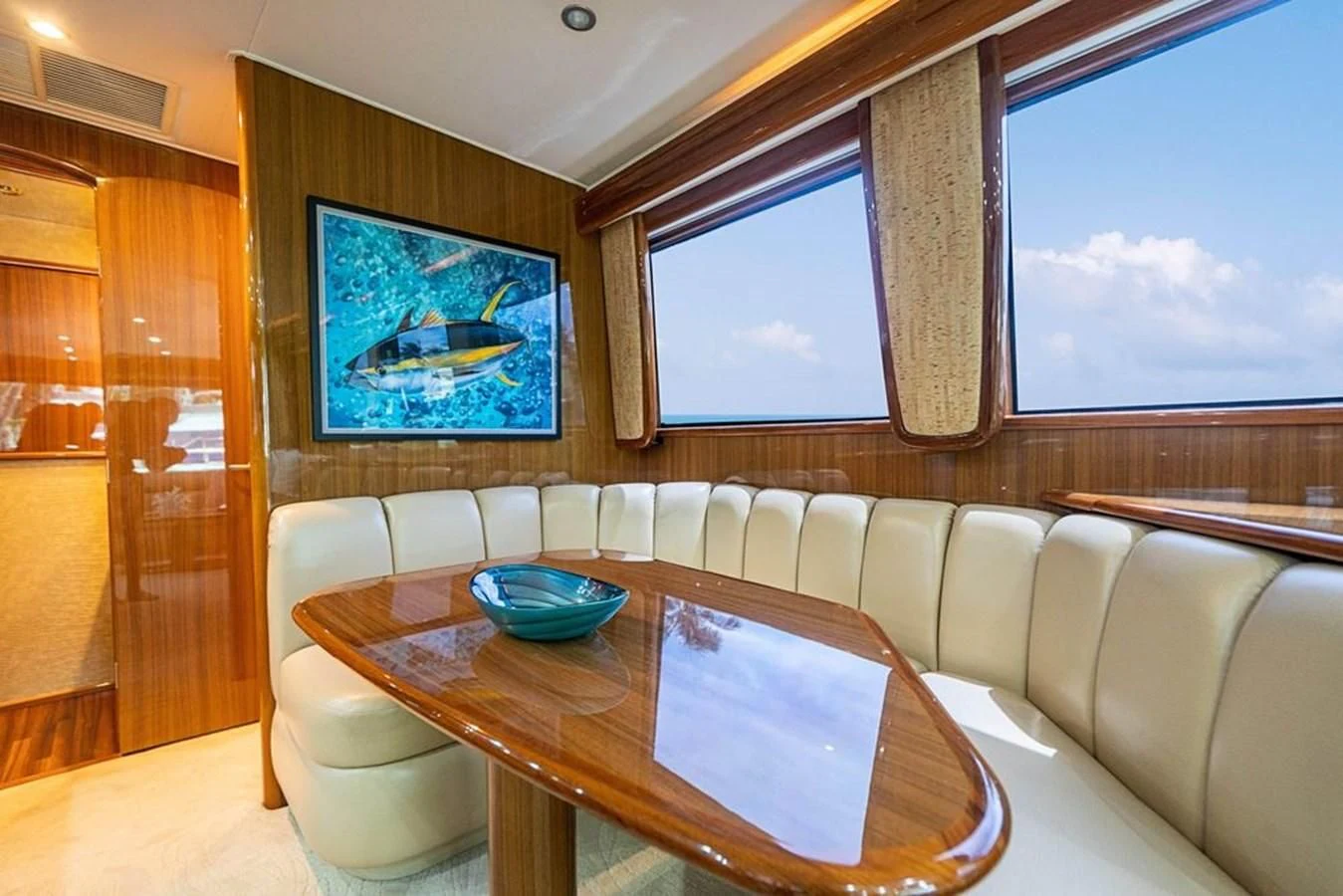a room with a table and chairs aboard KNOT RACING Yacht for Sale