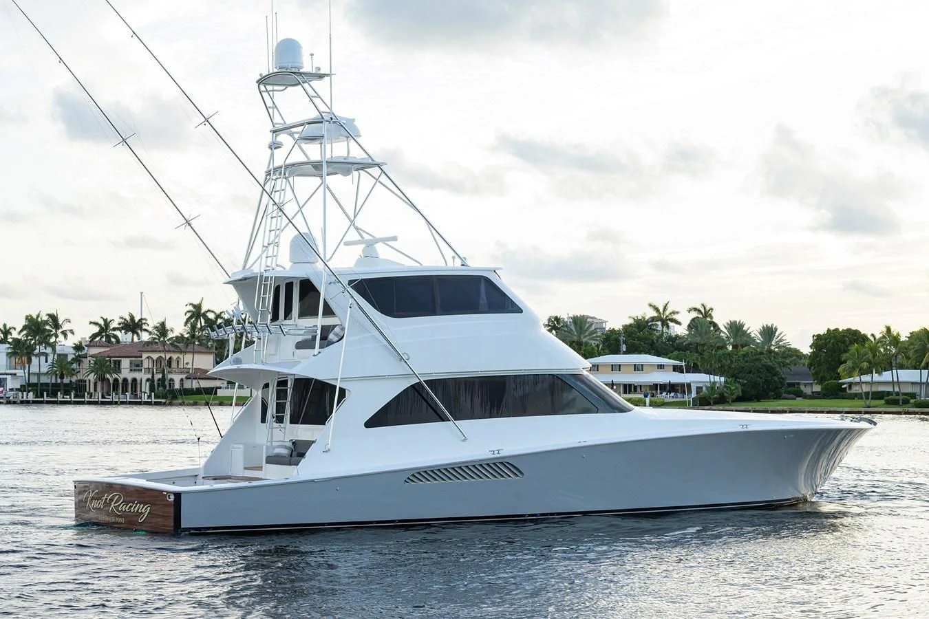 a white boat on the water aboard KNOT RACING Yacht for Sale