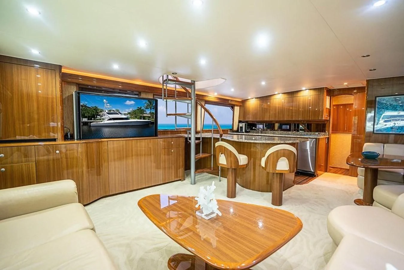 a large kitchen with a bar and a staircase aboard KNOT RACING Yacht for Sale