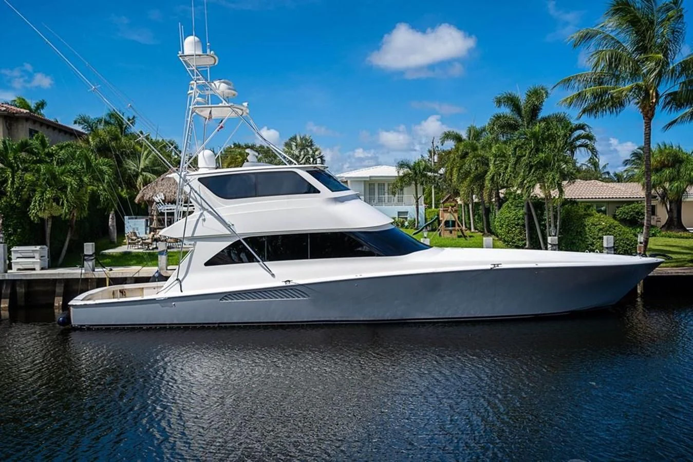 a white yacht docked at a dock aboard KNOT RACING Yacht for Sale