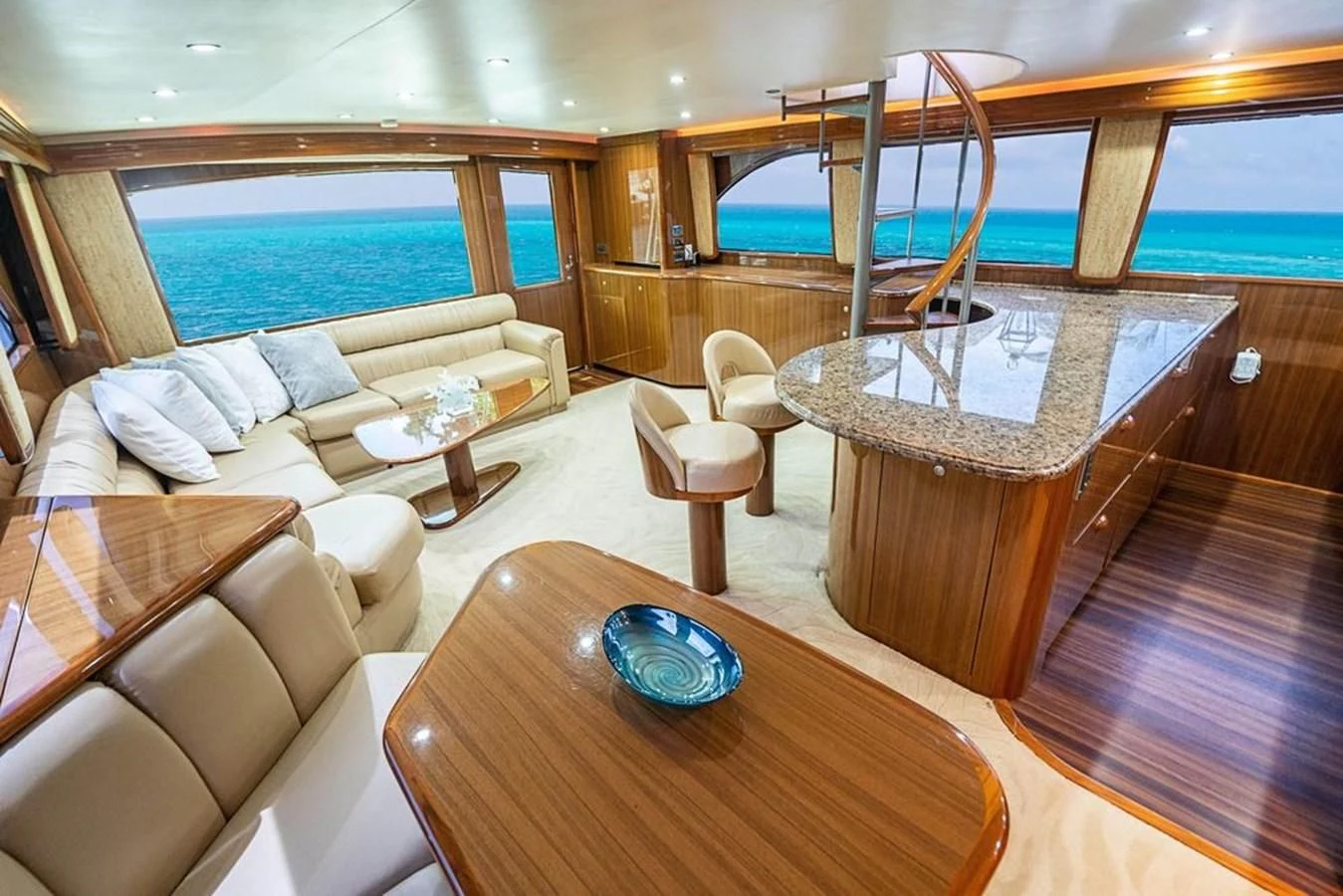 a living room with a table and chairs aboard KNOT RACING Yacht for Sale