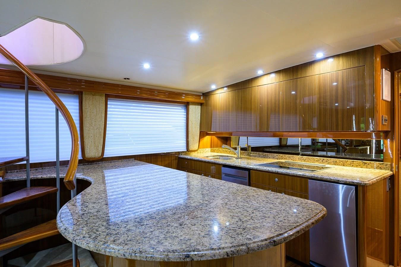 a kitchen with a large island aboard KNOT RACING Yacht for Sale