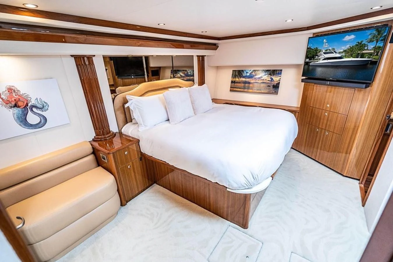 a room with a bed and a wood cabinet aboard KNOT RACING Yacht for Sale