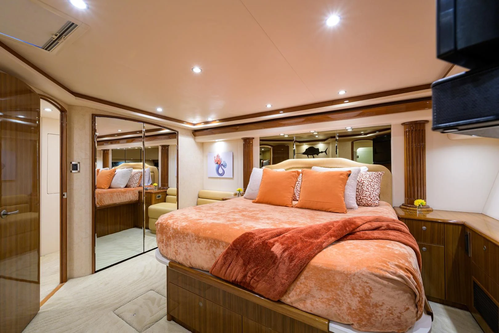 a bedroom with a bed and a television aboard KNOT RACING Yacht for Sale