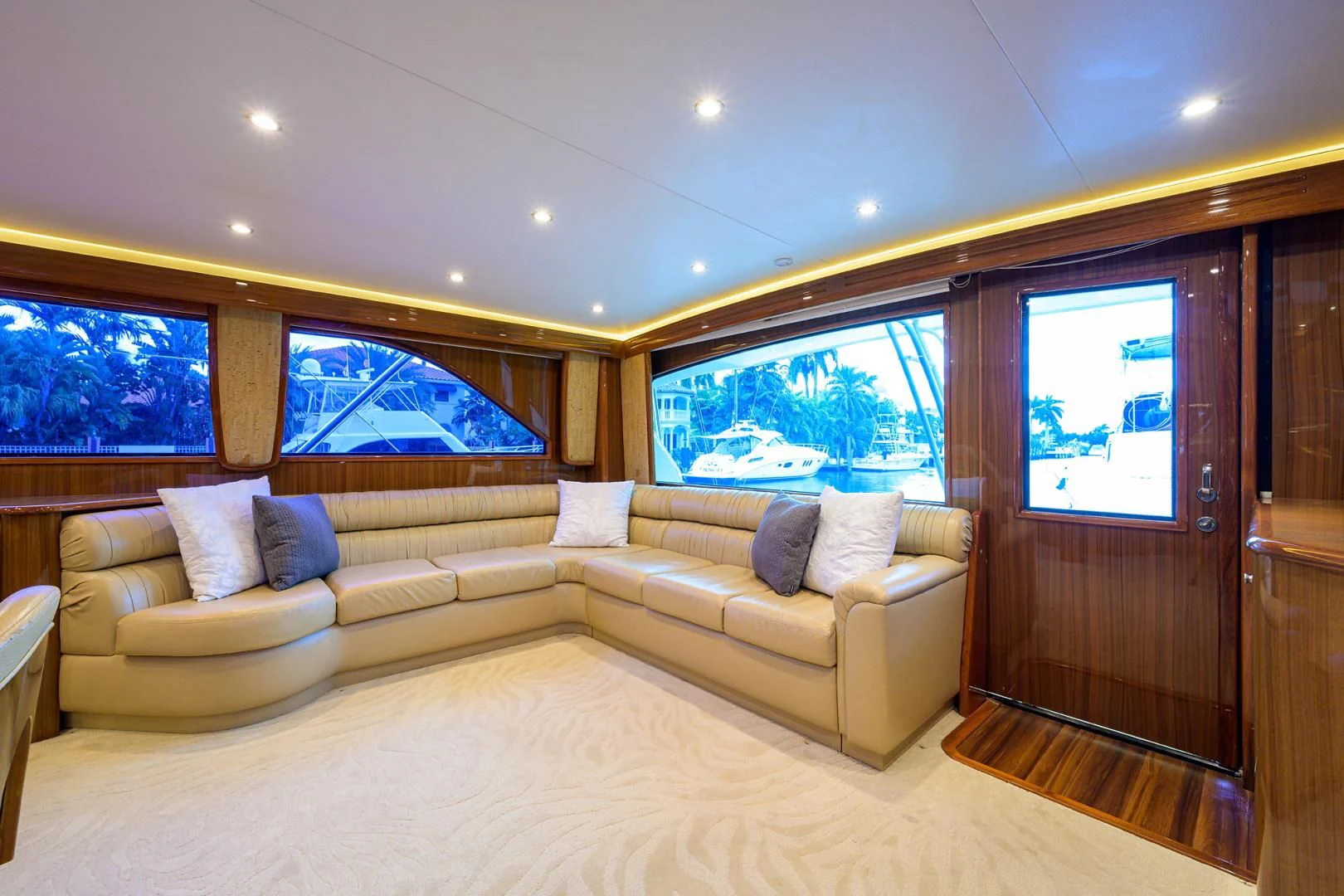 a living room with a couch and a large window aboard KNOT RACING Yacht for Sale